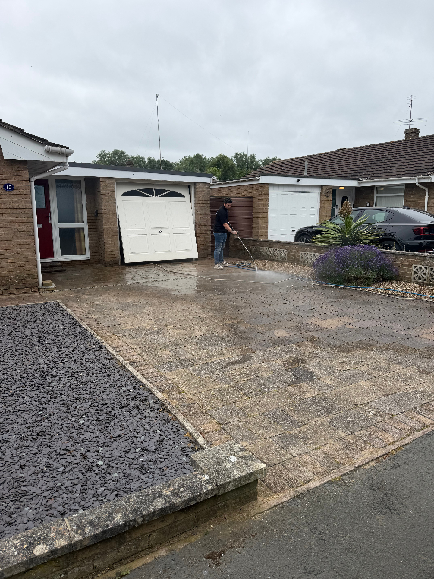 Wiltshire Surface Cleaning team pressure washing a real customer's driveway
